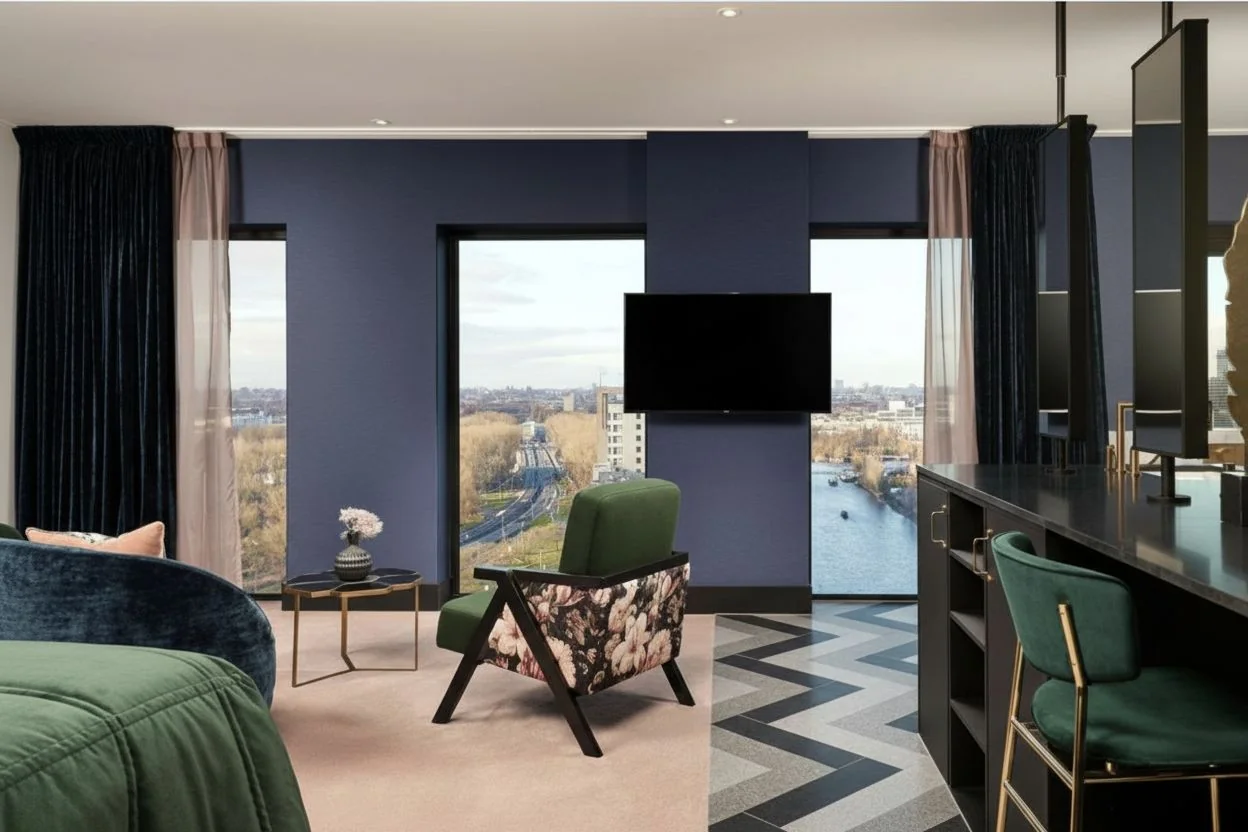 Penthouse Suite with floor-to-ceiling windows and Amstel River views